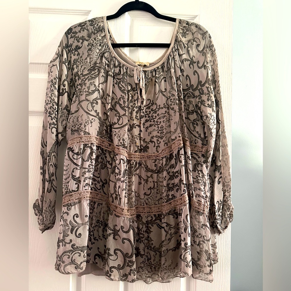 Grey/black top. Never worn . size small . can fit up to a large